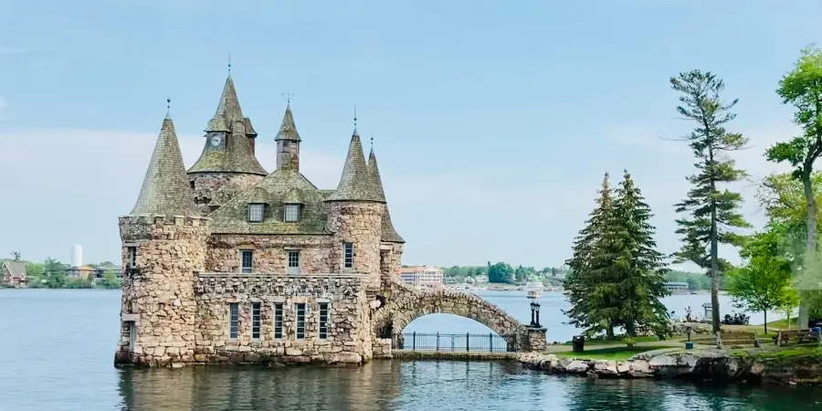 castle on a river island with bridge to land