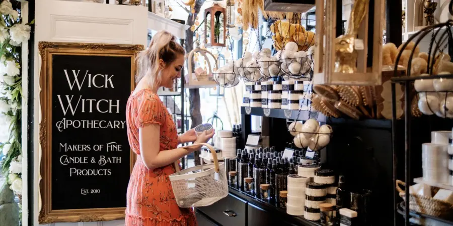 A nicely dressed woman in a quaint shop