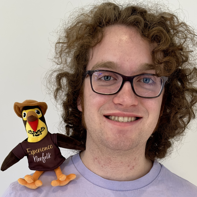 Norfolk Artist Will Welsh with Scout stuffie on shoulder