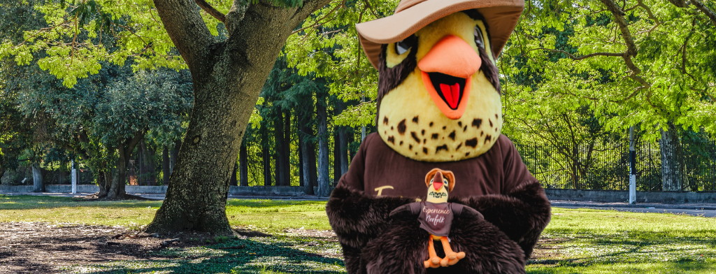 Lifesize Scout Mascot holding Scout the stuffie