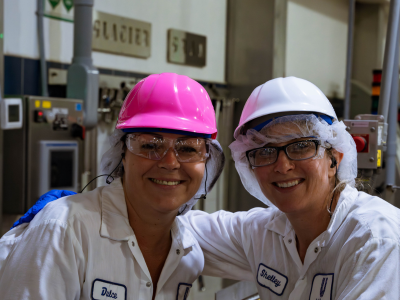 food processing workers with hard hats
