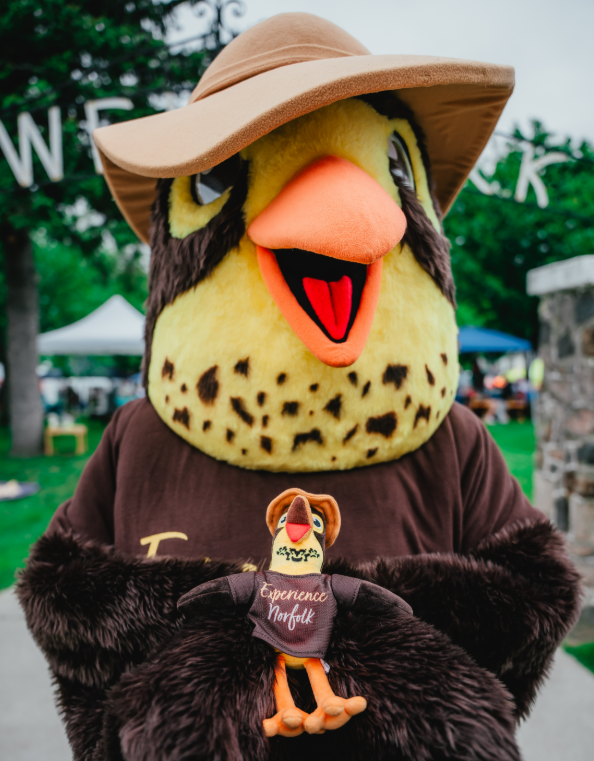 Scout mascot holding scout stuffie